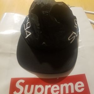 Supreme Black camp hat and comes with Supreme Bag